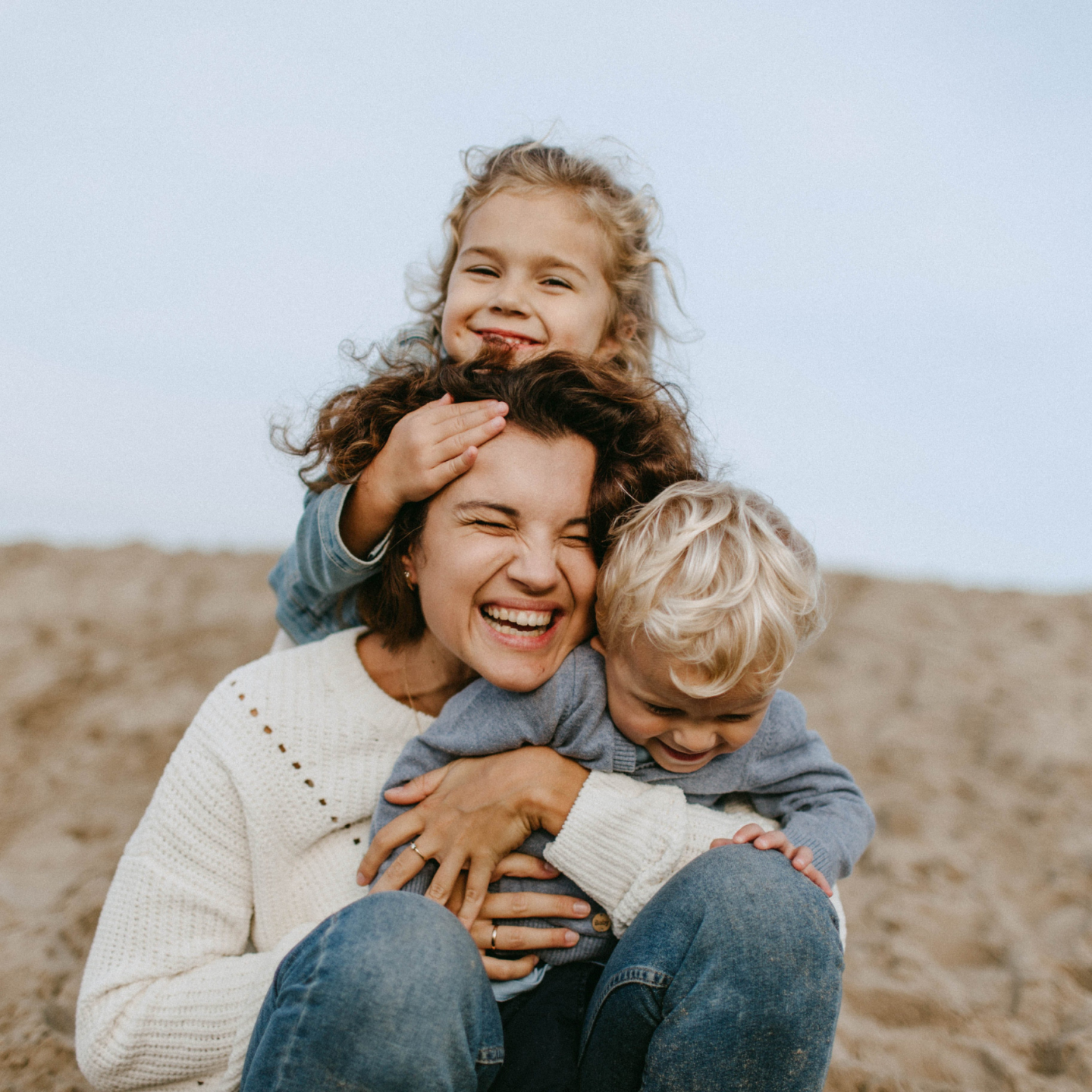 Smiling, happy mother with her children