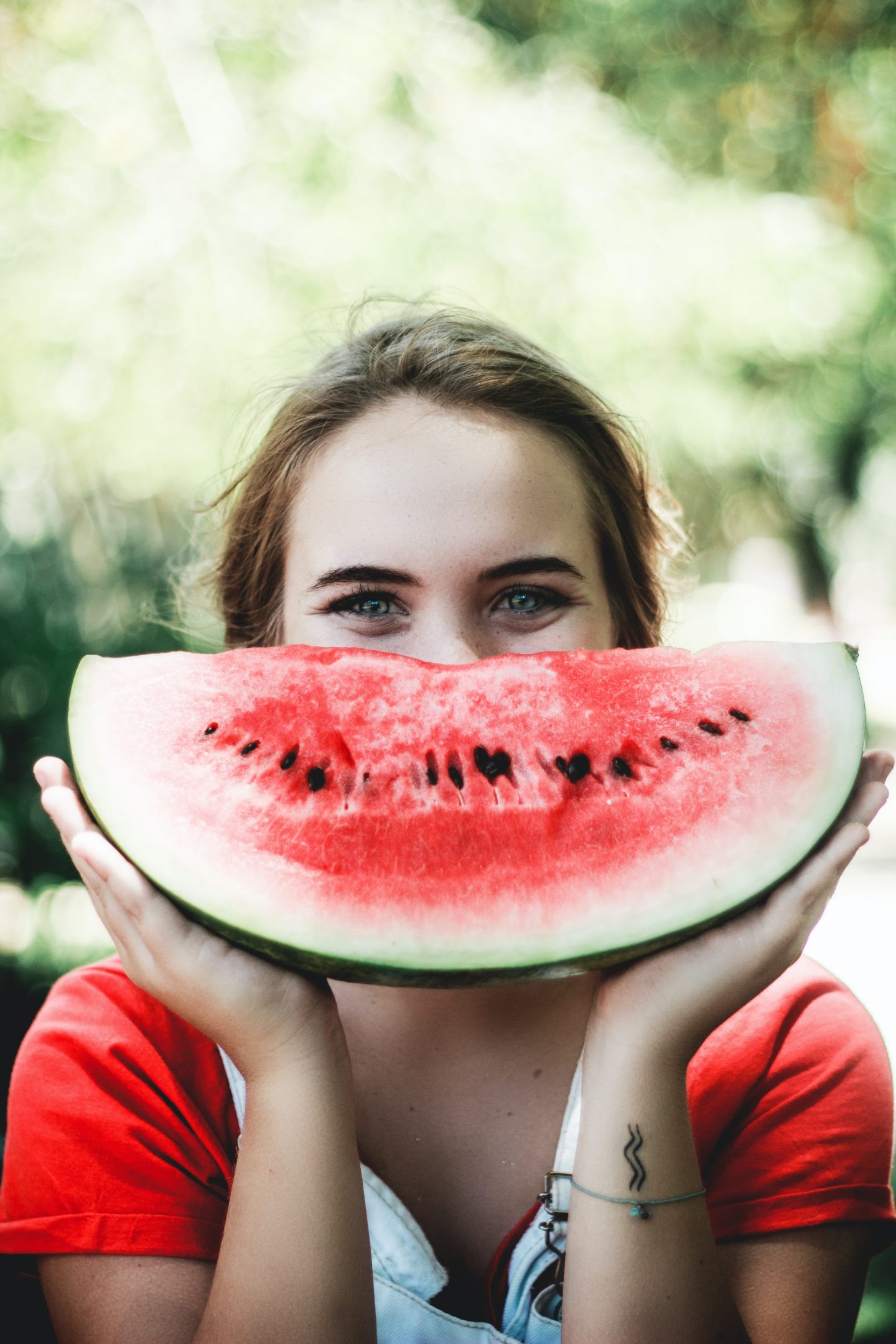 Woman with watermelon smile